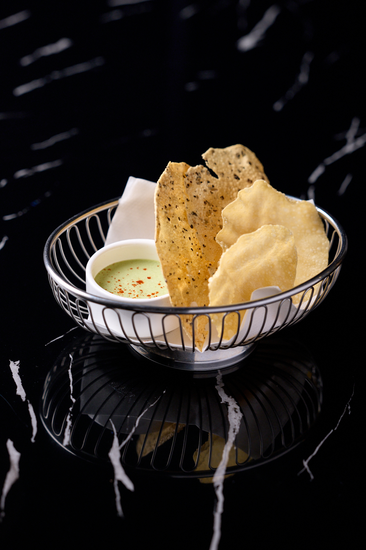 Traditional South Indian dish presented with aromatic garnishes and fresh accompaniments