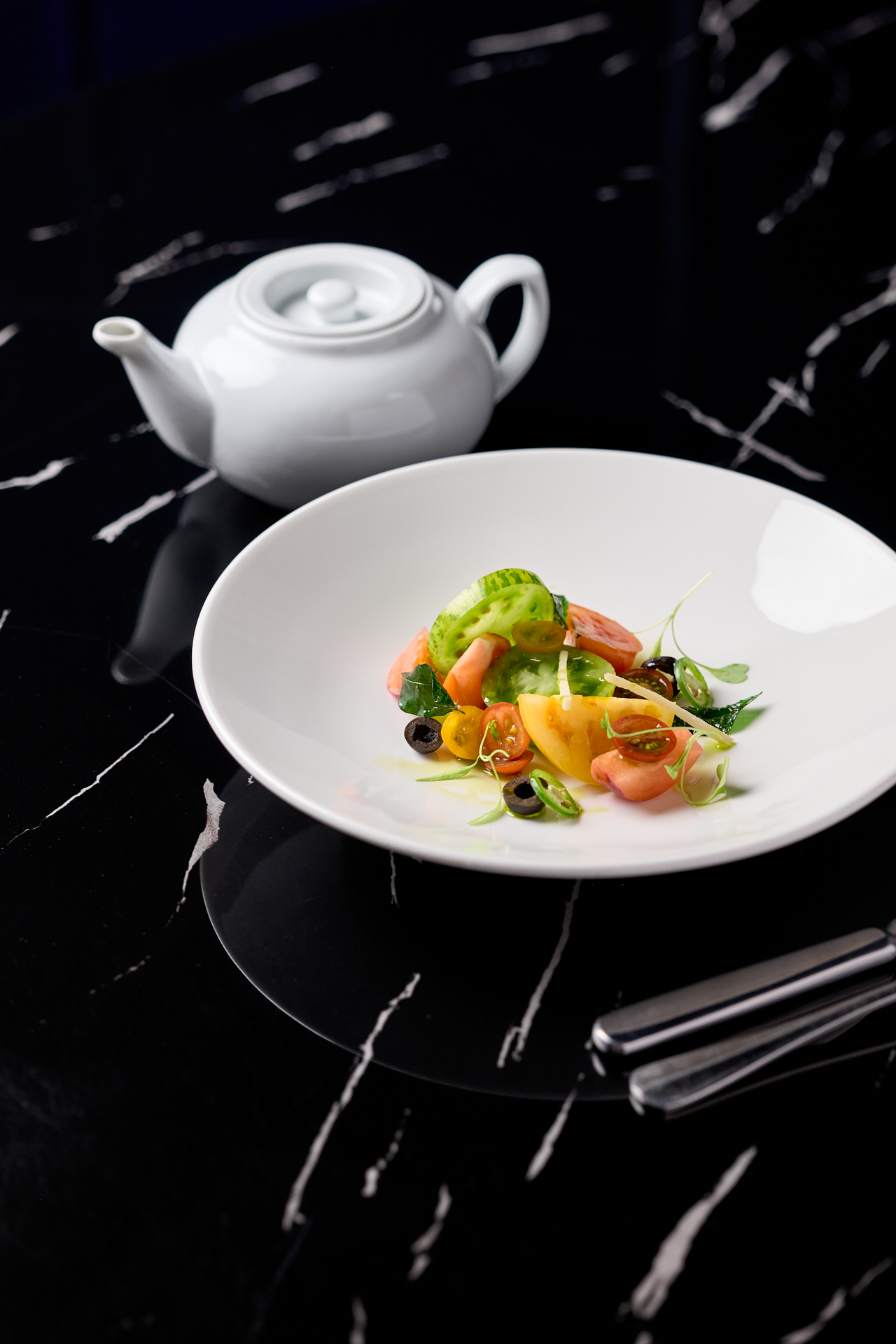 Vibrant curry dish with a medley of fresh herbs and traditional tempering